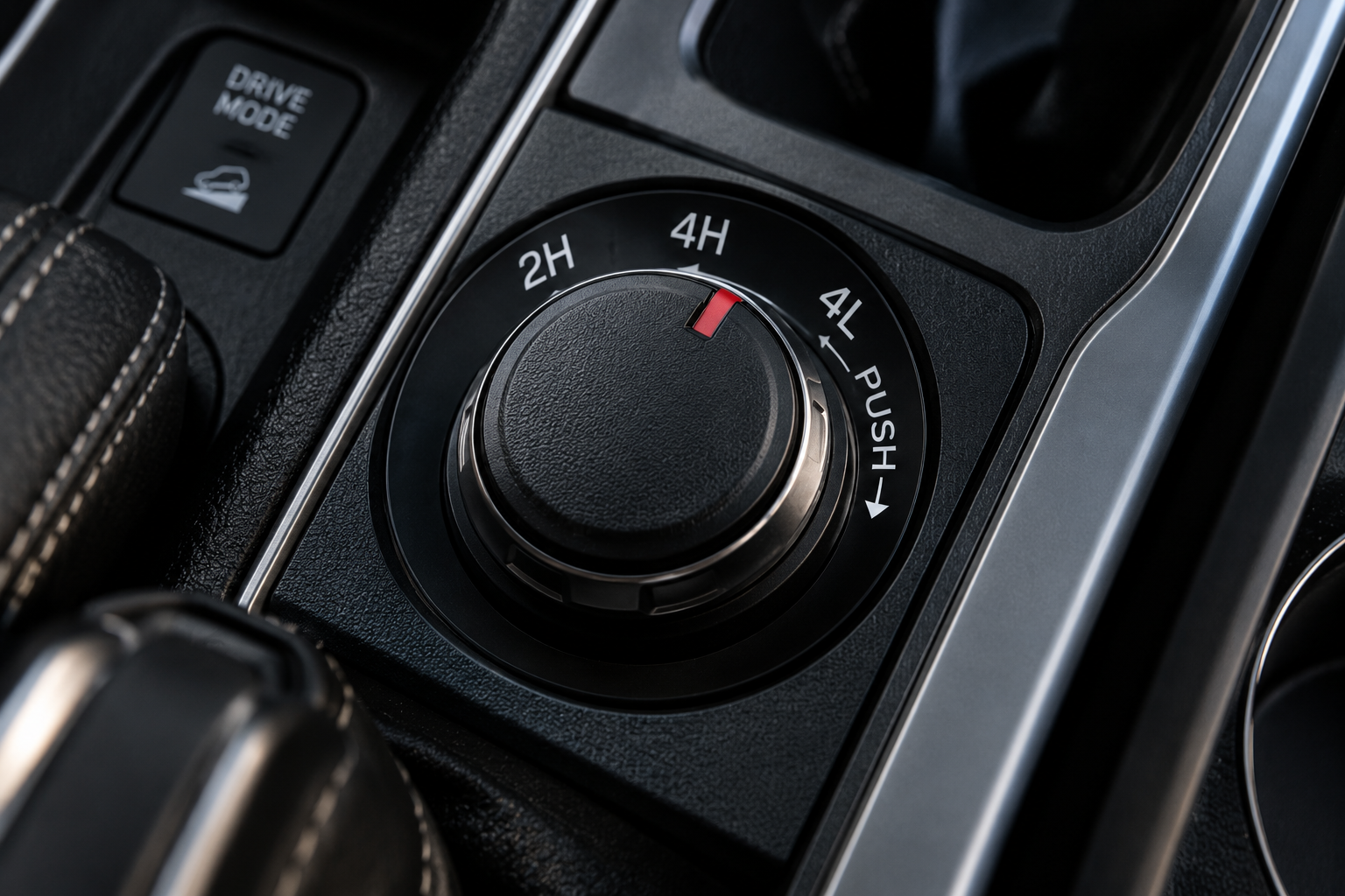 Four-wheel-drive selector showing 2H, 4H and 4L settings